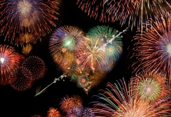 a heart made of fireworks, surrounded by fireworks