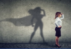 Woman looking forward with her shadow as a superhero, Transform, New Perspective