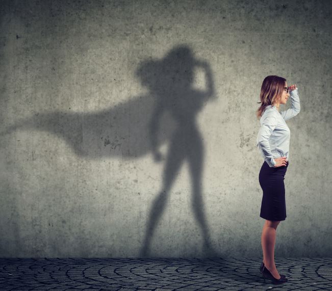 Lady looking forward with a shadow like a super hero, Transform, New Perspective